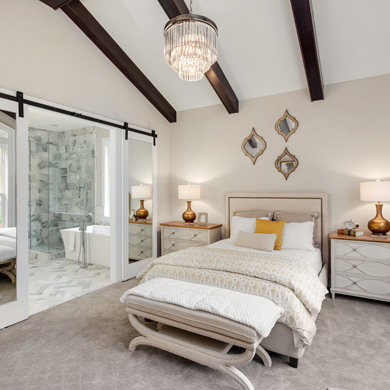 bedroom and master bathroom in new luxury home